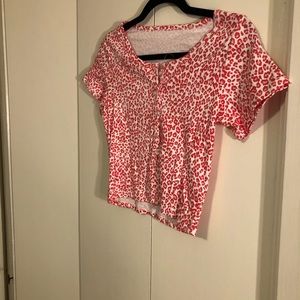 Shirt colors are reddish with pale pink and white